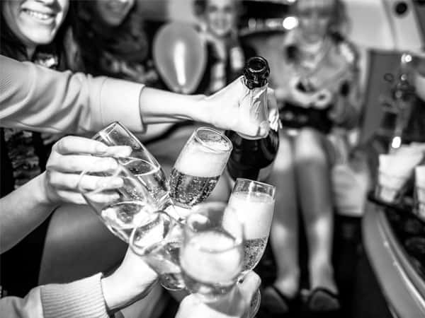 Champagne glasses inside a Starlite limousine