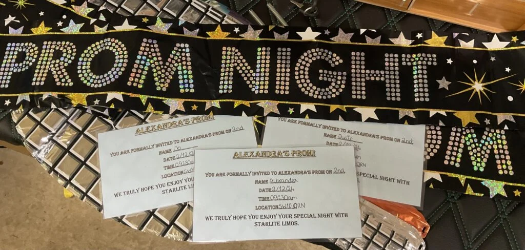Prom Night banner beside personalised invitations from Starlite Limos