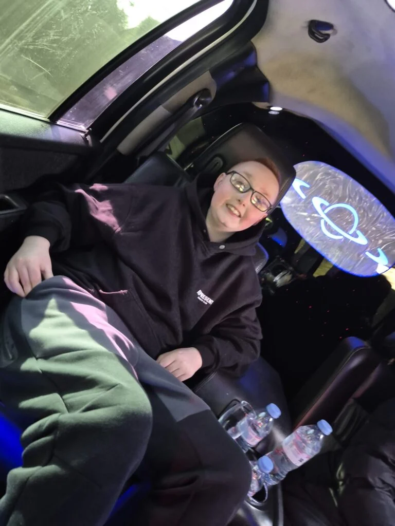 Young guest relaxing in the limousine cabin during the journey