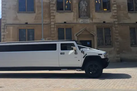 White stretch Hummer limousine, front view